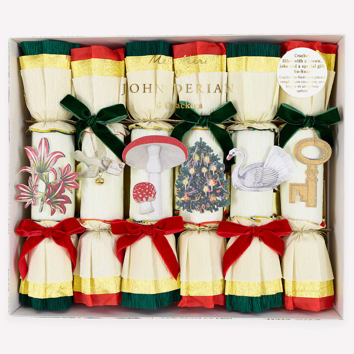 Box of John Derian Christmas crackers with decorative designs and ribbons.