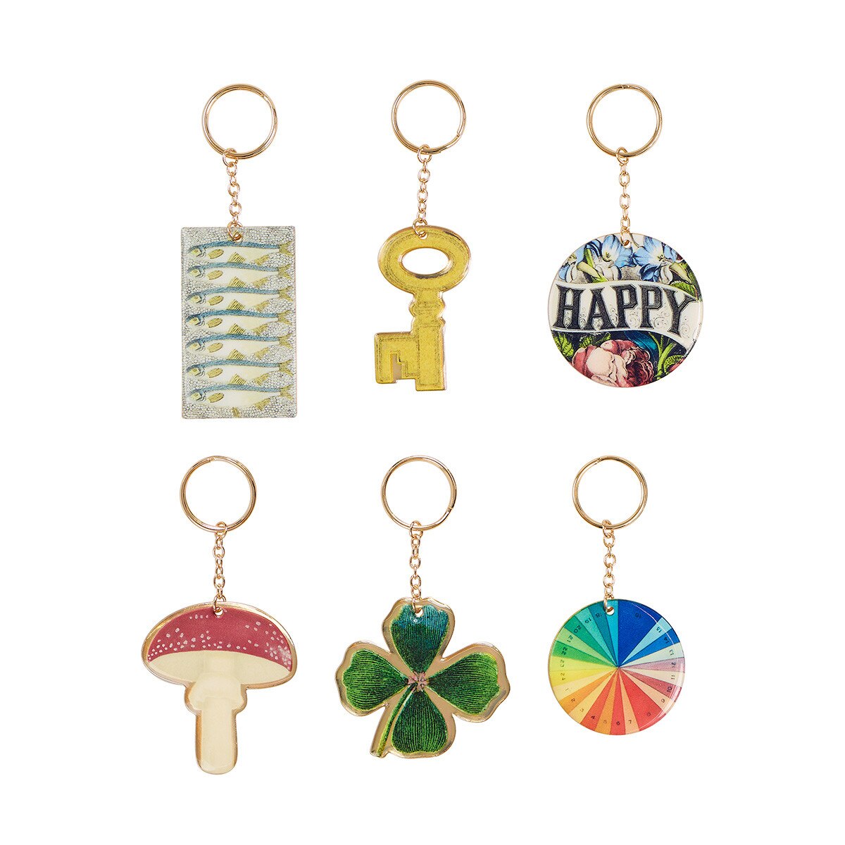 Six colorful enamel keychains arranged in two rows on a plain white background. The keychains include a fish-patterned rectangular piece, a gold key-shaped charm, a round &