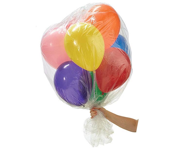 Hand holding a bundle of colorful balloons wrapped in clear plastic on a white background.