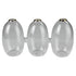 Three vintage-style clear glass bud vases fused together in a row, featuring delicate gold-painted rims and holding single-stem dried botanicals against a neutral background.