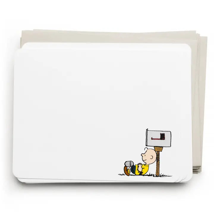 A stack of white rectangular cards or envelopes with rounded corners, featuring a small printed cartoon illustration at the lower right of a character sitting beside a mailbox. The cards are photographed on a clean white background.