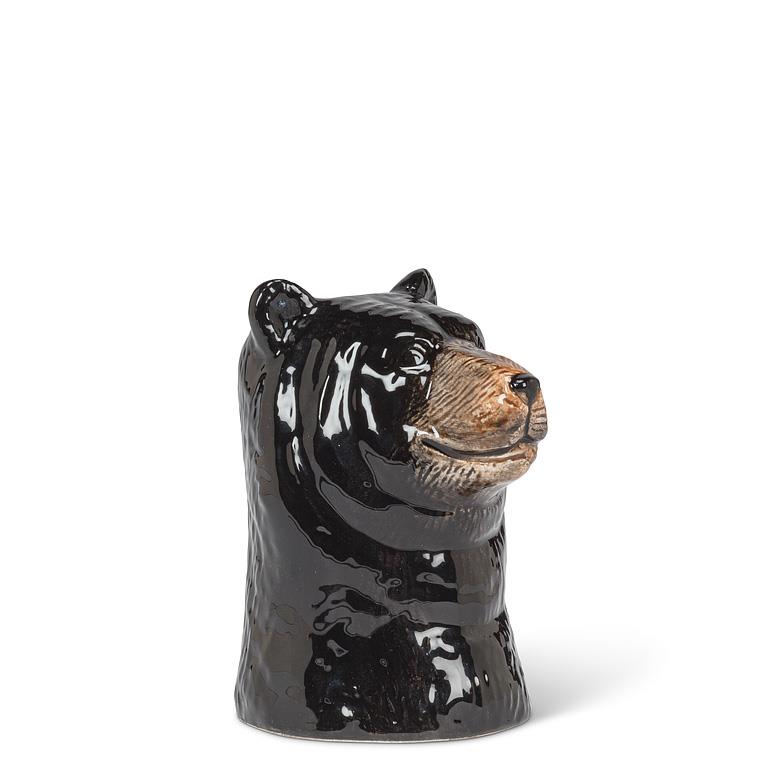 Black ceramic bear head on a white background.