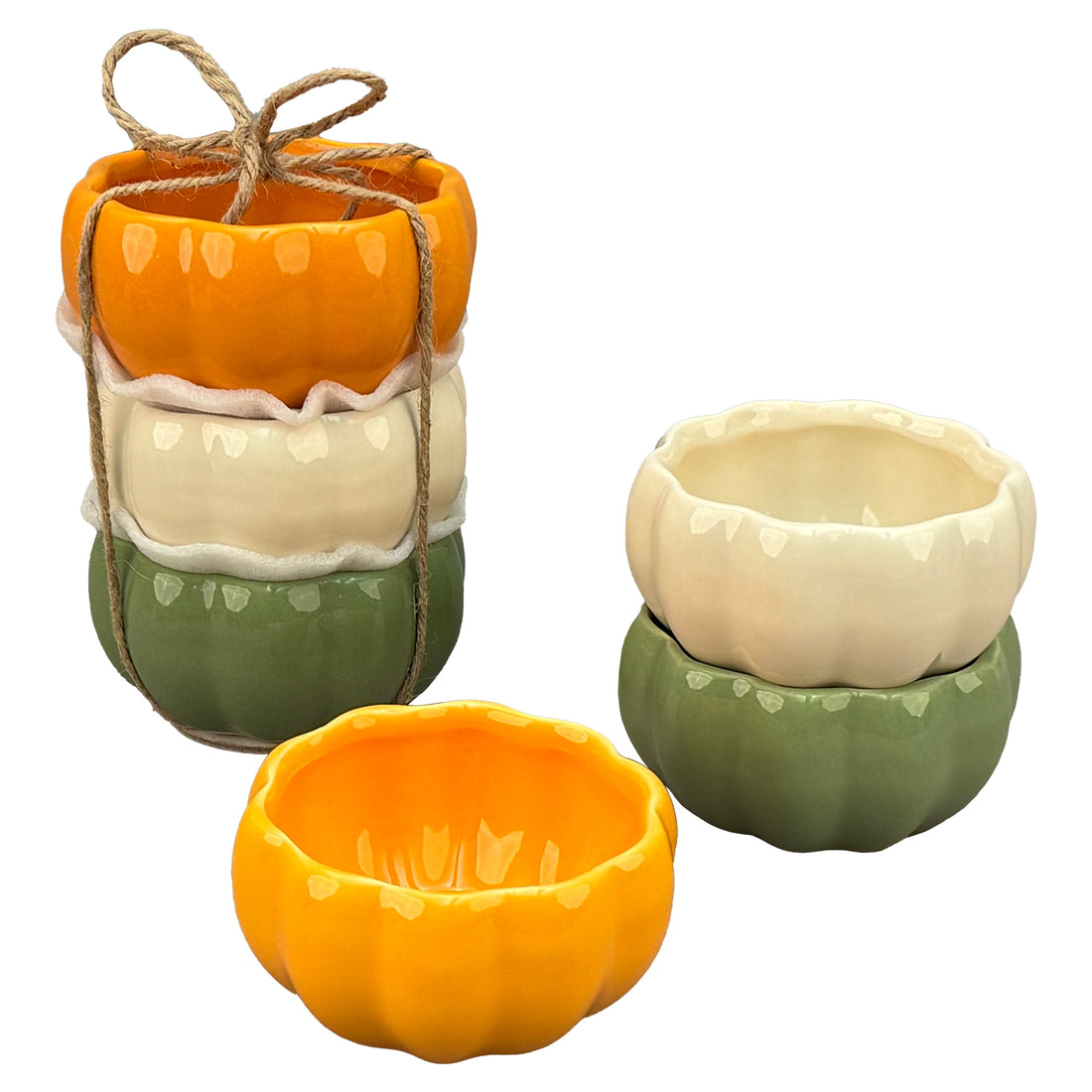 Set of ceramic pumpkin-shaped ramekins in orange, green, and white on a white background.