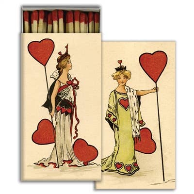 A matchbox with illustrations of women holding oversized hearts in a vintage aesthetic. 
