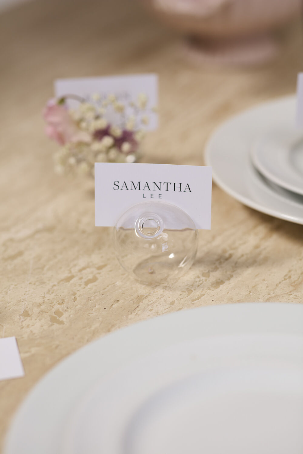 Table setting with a name card holder displaying &