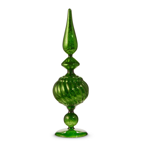 A green glass finial with a tapered top and ribbed texture.