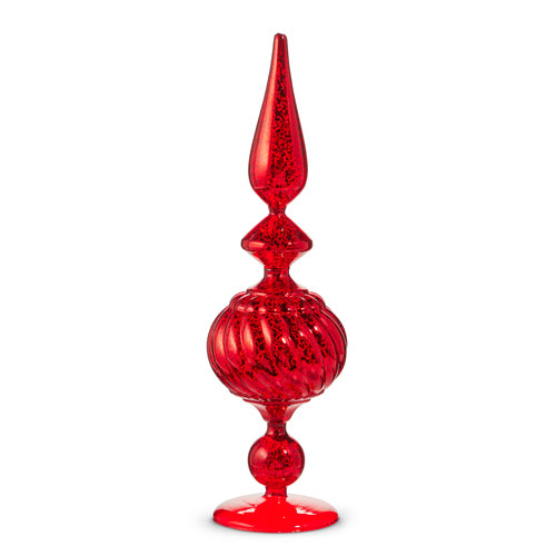 A red glass finial with a tapered top and ribbed texture.