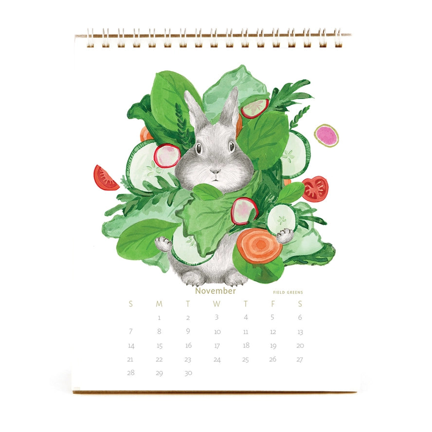 Calendar with a rabbit surrounded by vegetables on a white background
