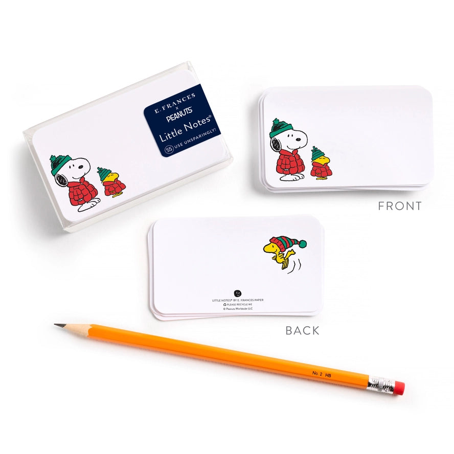 A set of three white rectangular cards or bookmarks featuring Peanuts character Snoopy illustrations, shown on a white background with a yellow pencil. Two cards are labeled FRONT and BACK, showing both sides of the product.