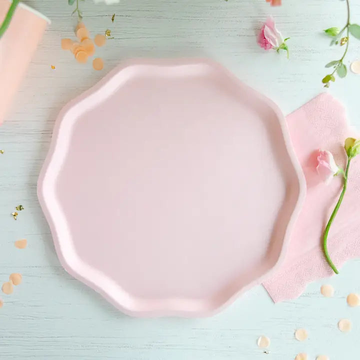 Pink octagonal plate on a light blue background with flowers and confetti.