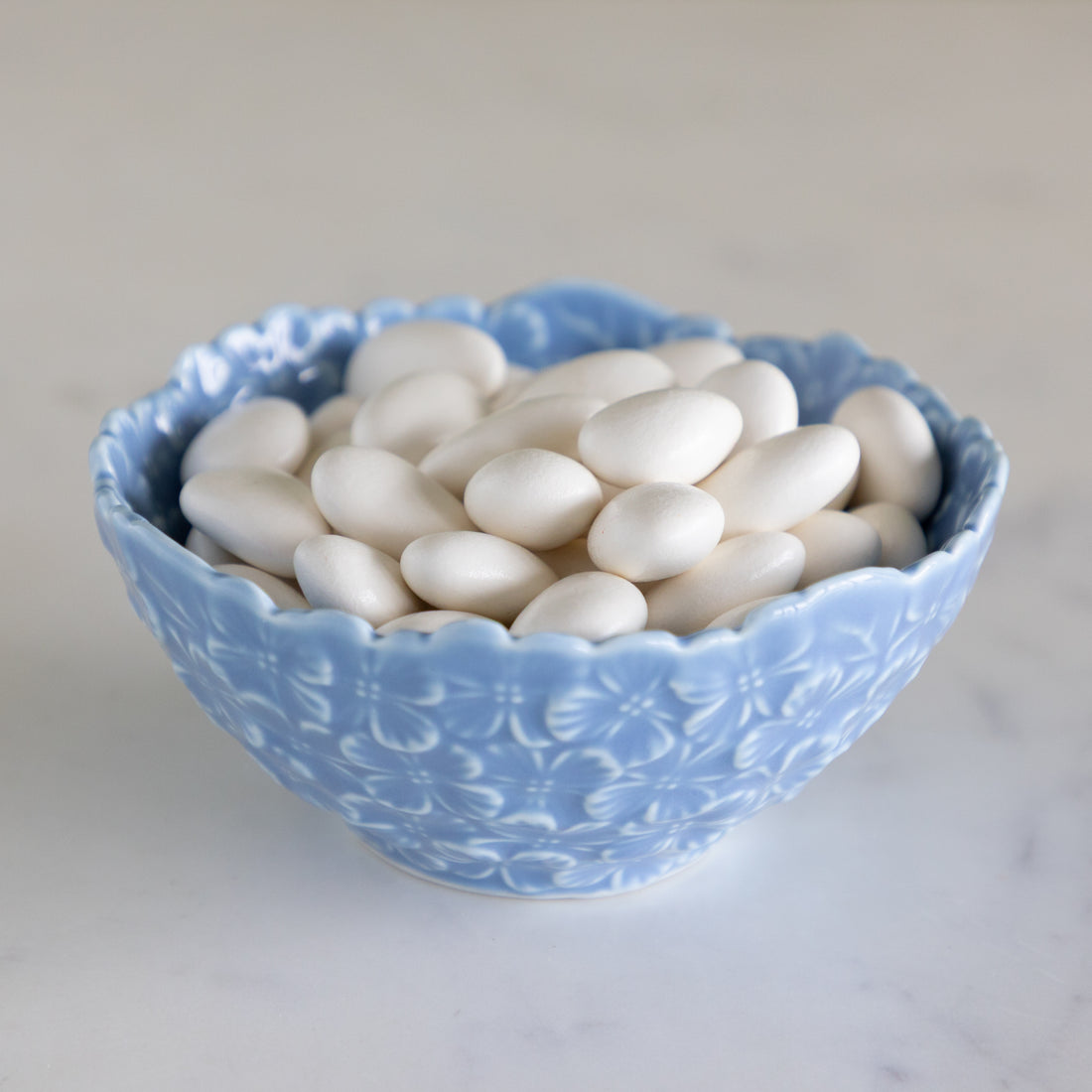 Hydrangea Tidbit Bowl filled with white chocolate covered almonds.