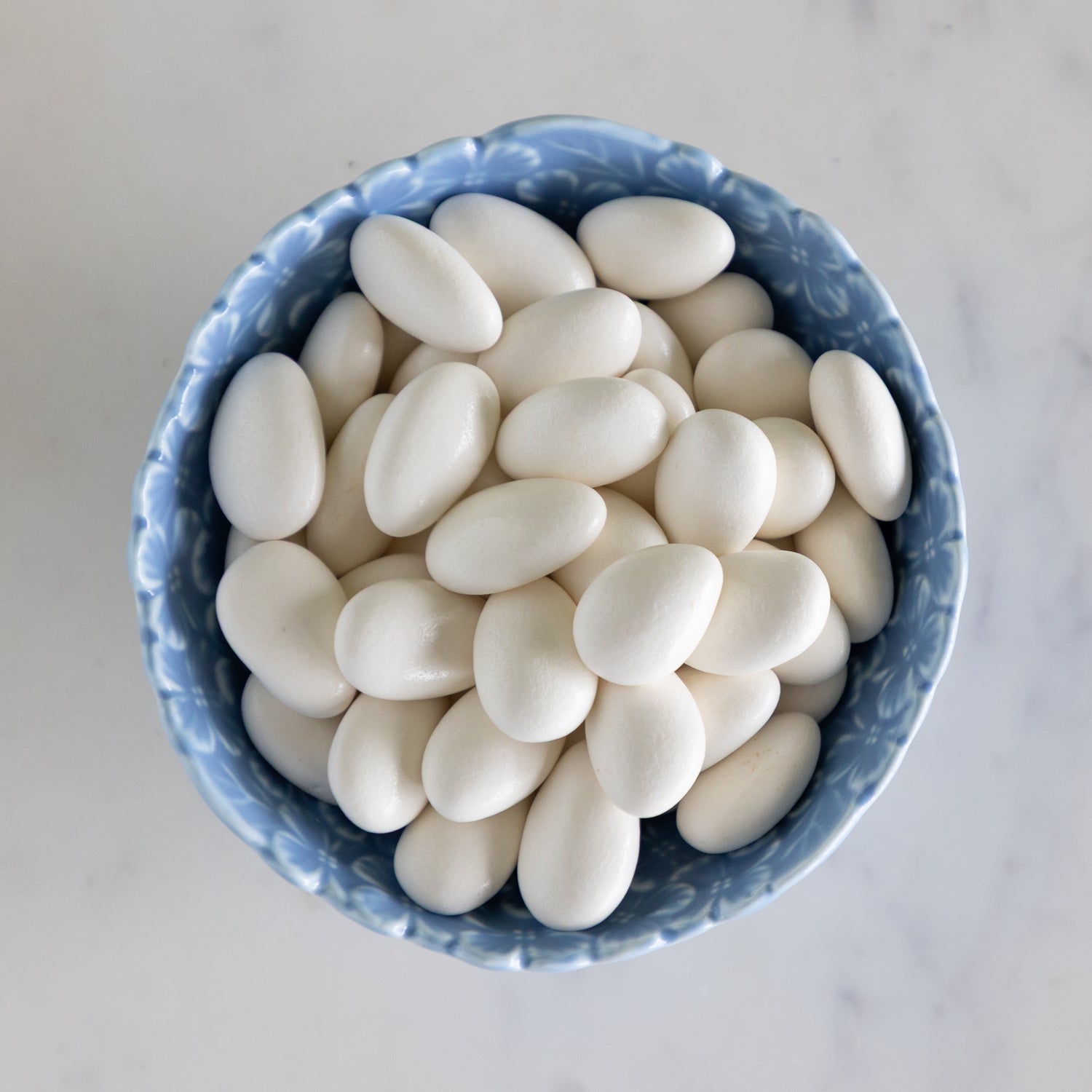Hydrangea Tidbit Bowl filled with white chocolate covered almonds.