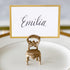 A gold-framed place card with the name &