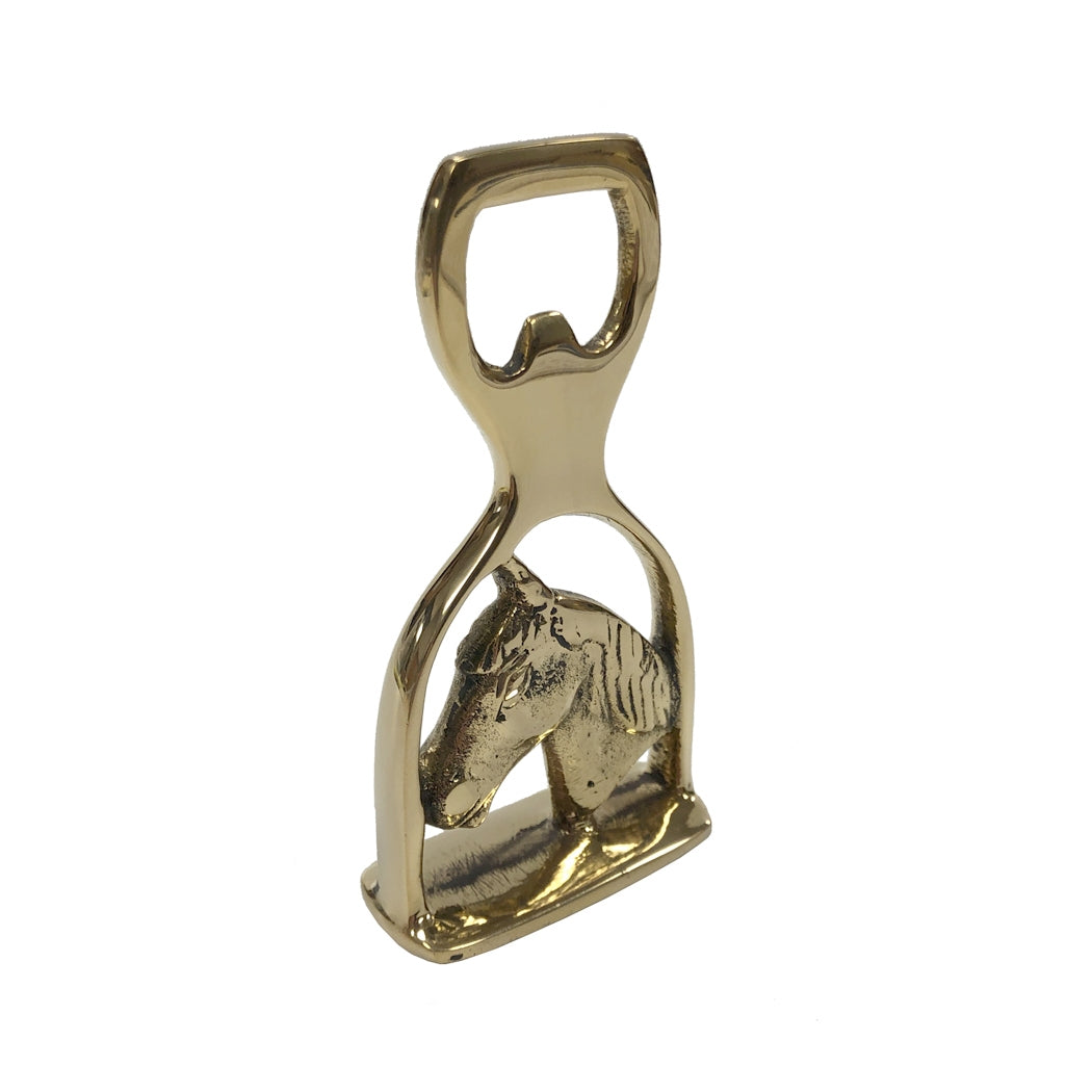 A gold-finished metal bottle opener shaped like a horse head, shown on a plain white background.