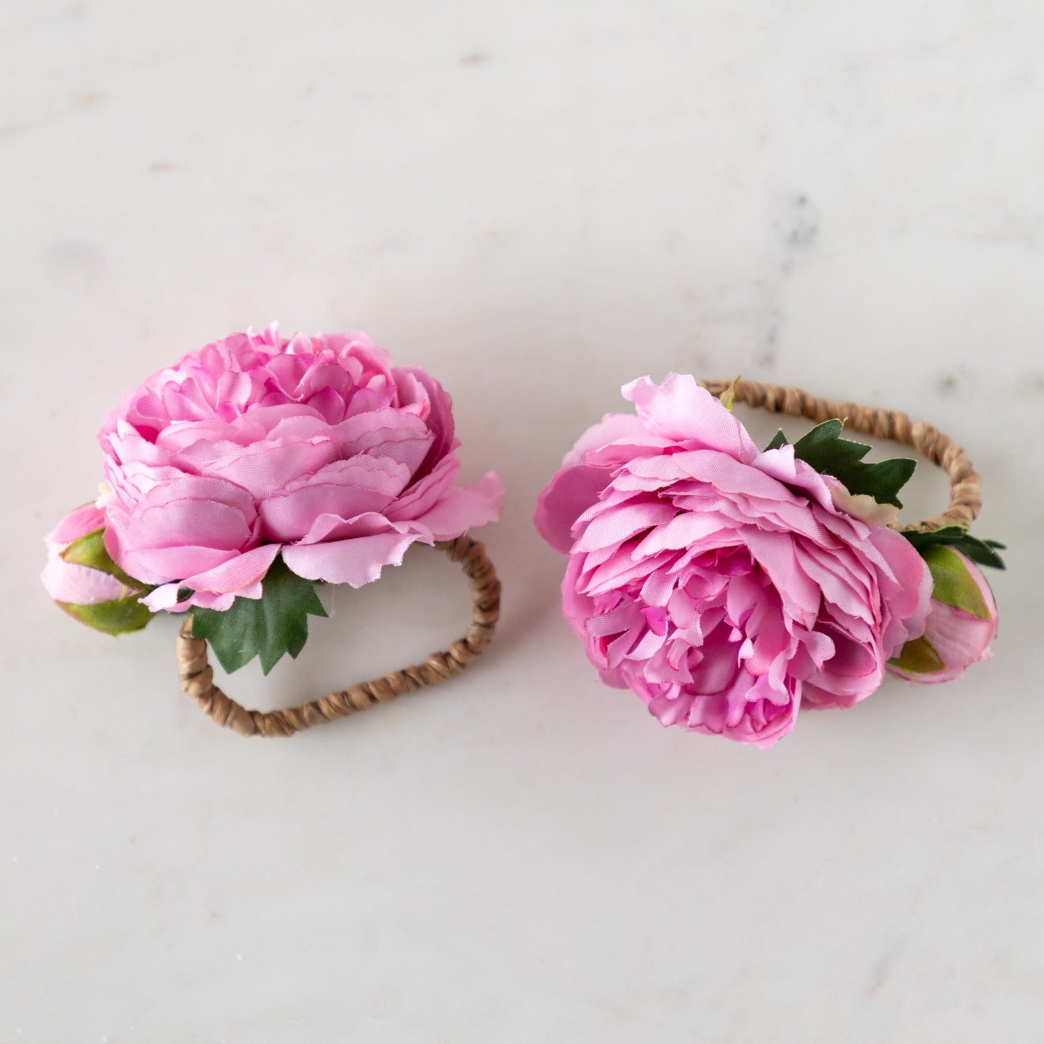 Pink Buttercup &amp; Bud Napkin Rings with rattan holders.