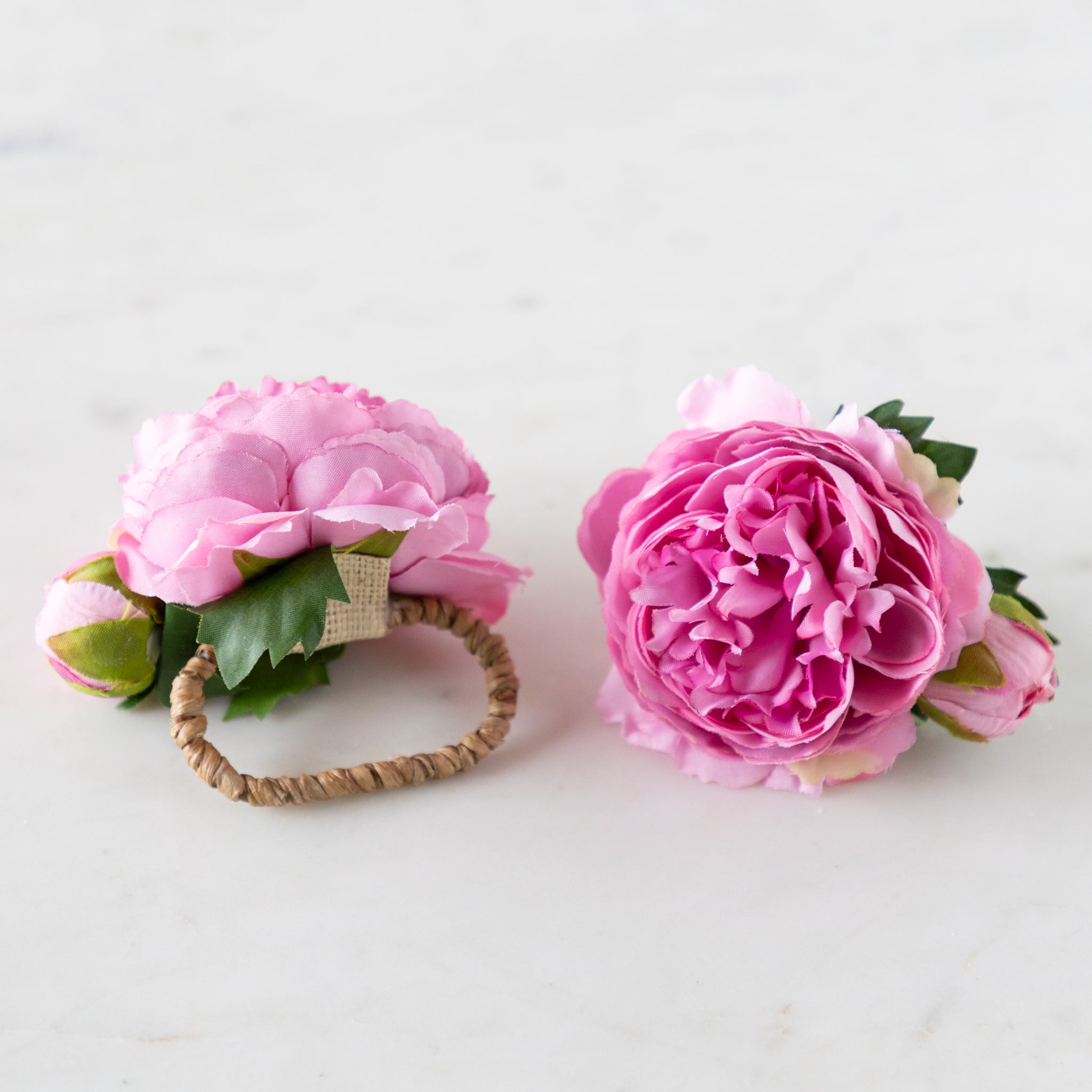Pink Buttercup &amp; Bud Napkin Rings with rattan holders.