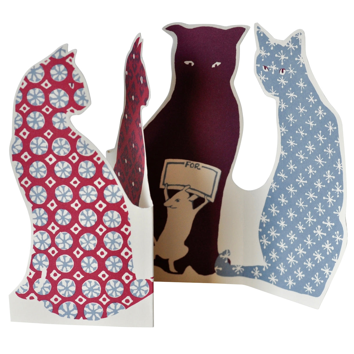 Greeting card in the shape of cats with calico printing on them. 