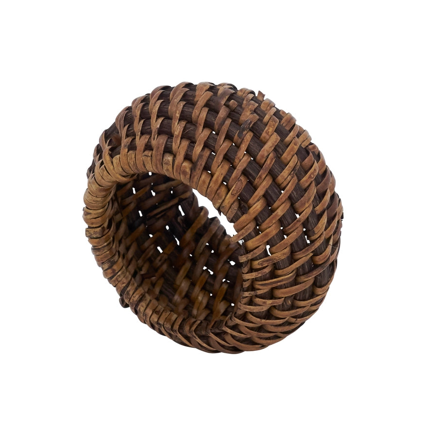 A brown woven rattan napkin ring, isolated on a solid white background.
