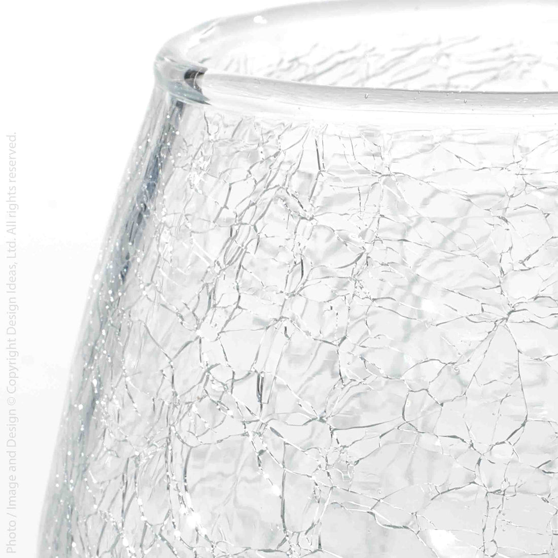 Close-up of a clear glass vessel with a textured crackle pattern on a white background.