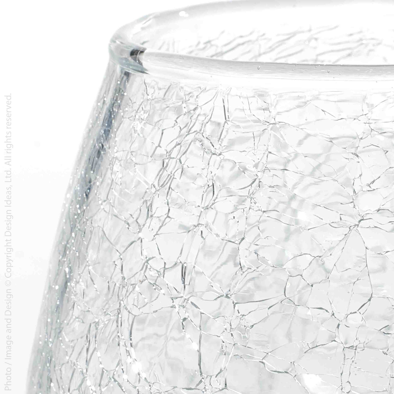 Close-up of a clear glass vessel with a textured crackle pattern on a white background.