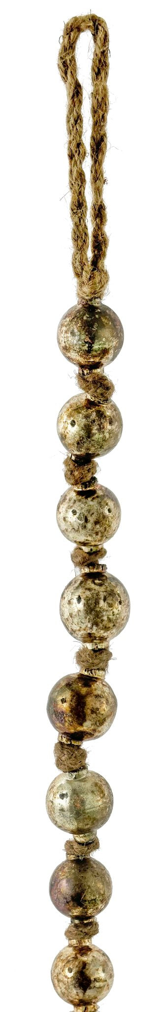 String of metallic beads with a rope end on a white background.