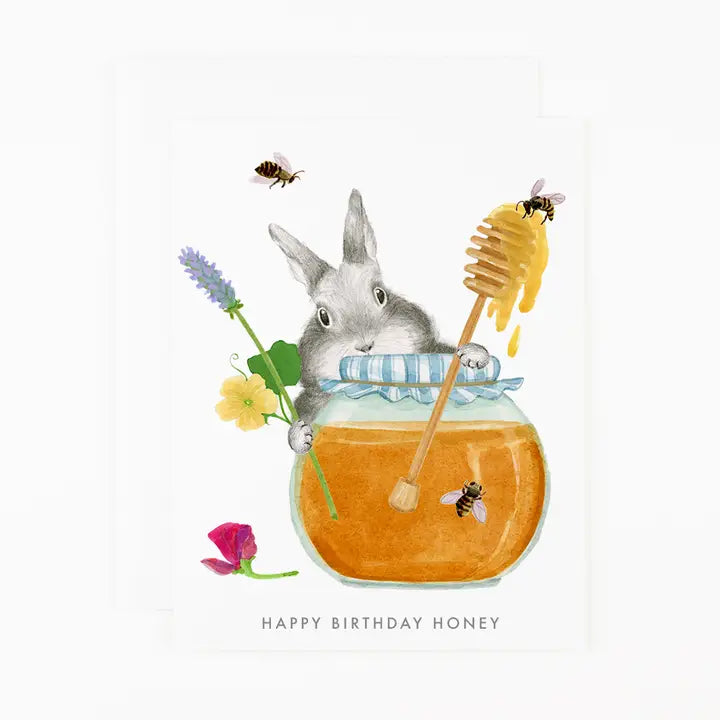 Illustration of a rabbit in a honey jar with flowers and bees, featuring &