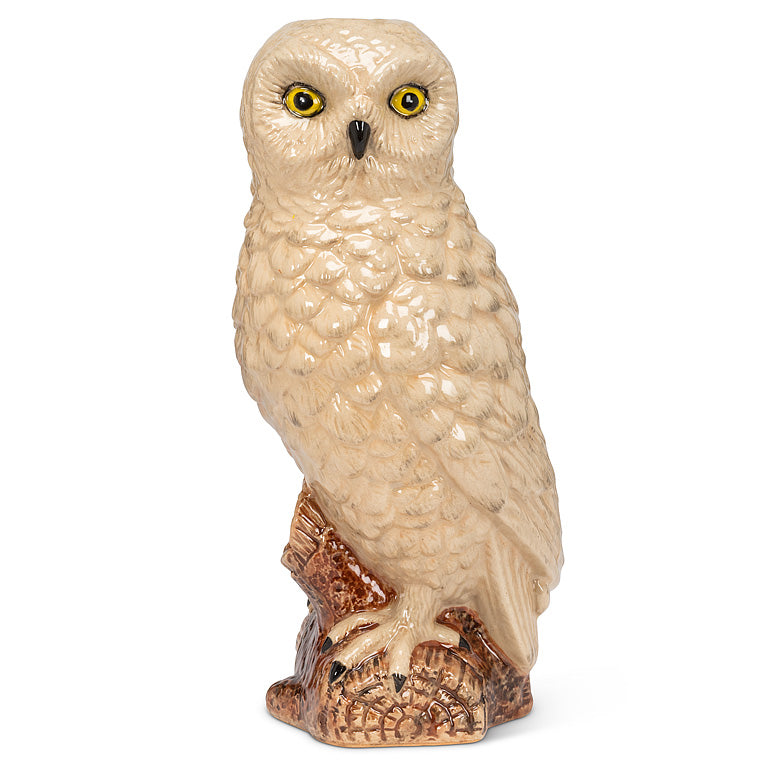 White owl figurine on a white background.