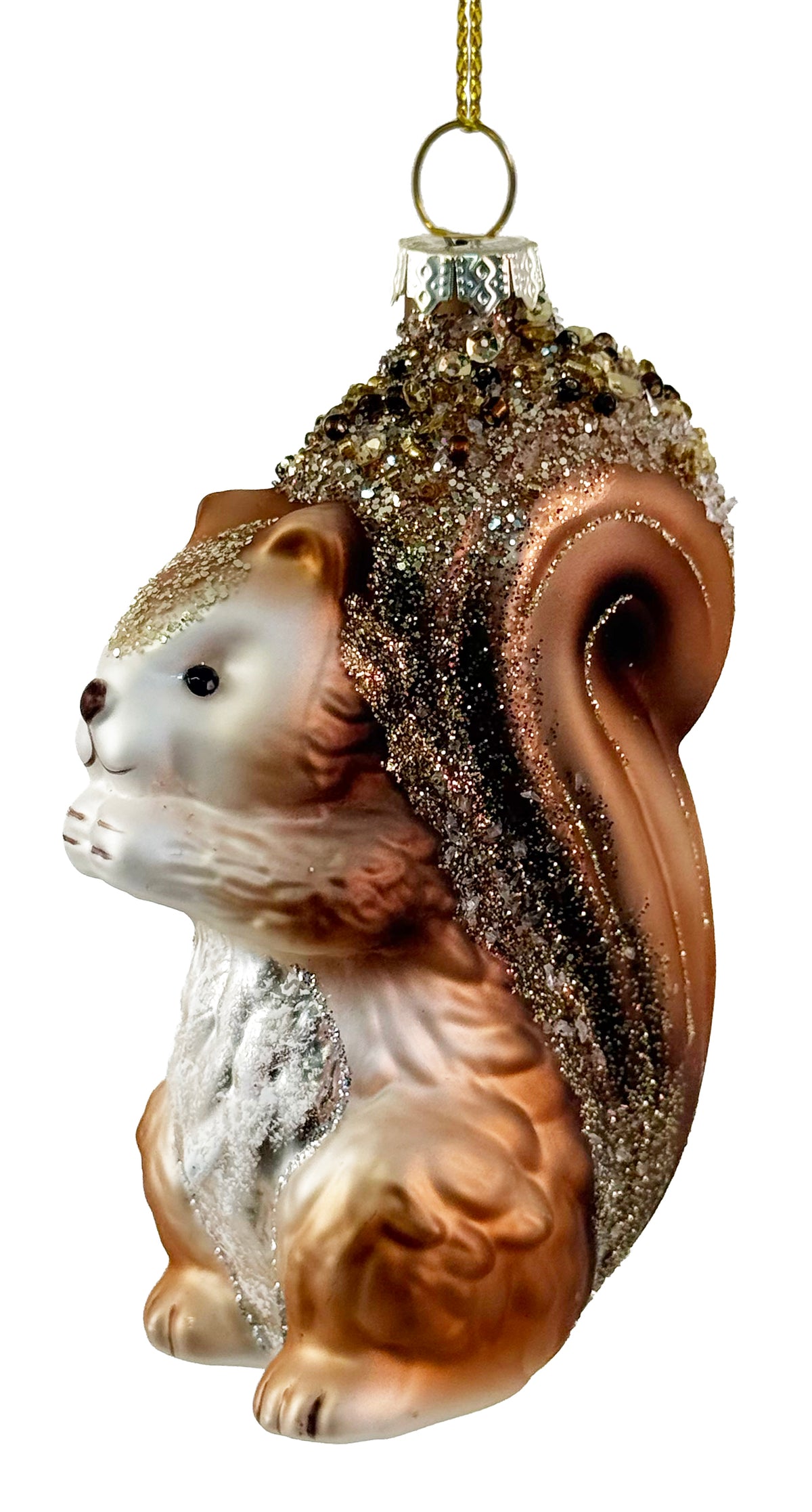 A blown glass ornament shaped like a rust brown squirrel with its head and tail covered in gold glitter, on a white background. 