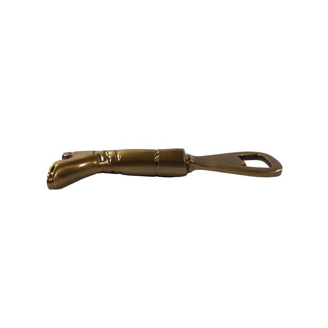 Brass boot-shaped bottle opener on a white background.