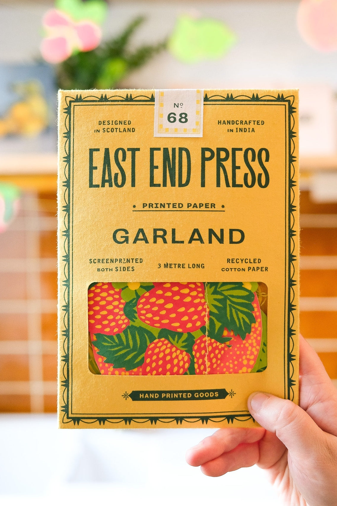 Packaged product from East End Press with a hand holding it.
