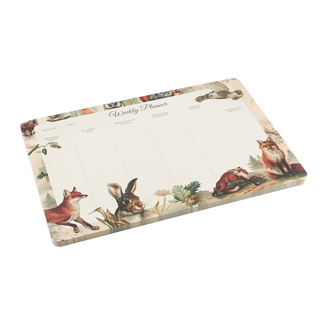 A weekly planner with an owl, fox and bunny rabbit printed on it. 