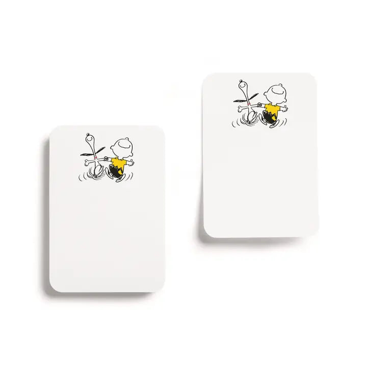 Two white rectangular cards with rounded corners, each printed with a small black-and-white cartoon character, shown on a clean white background.