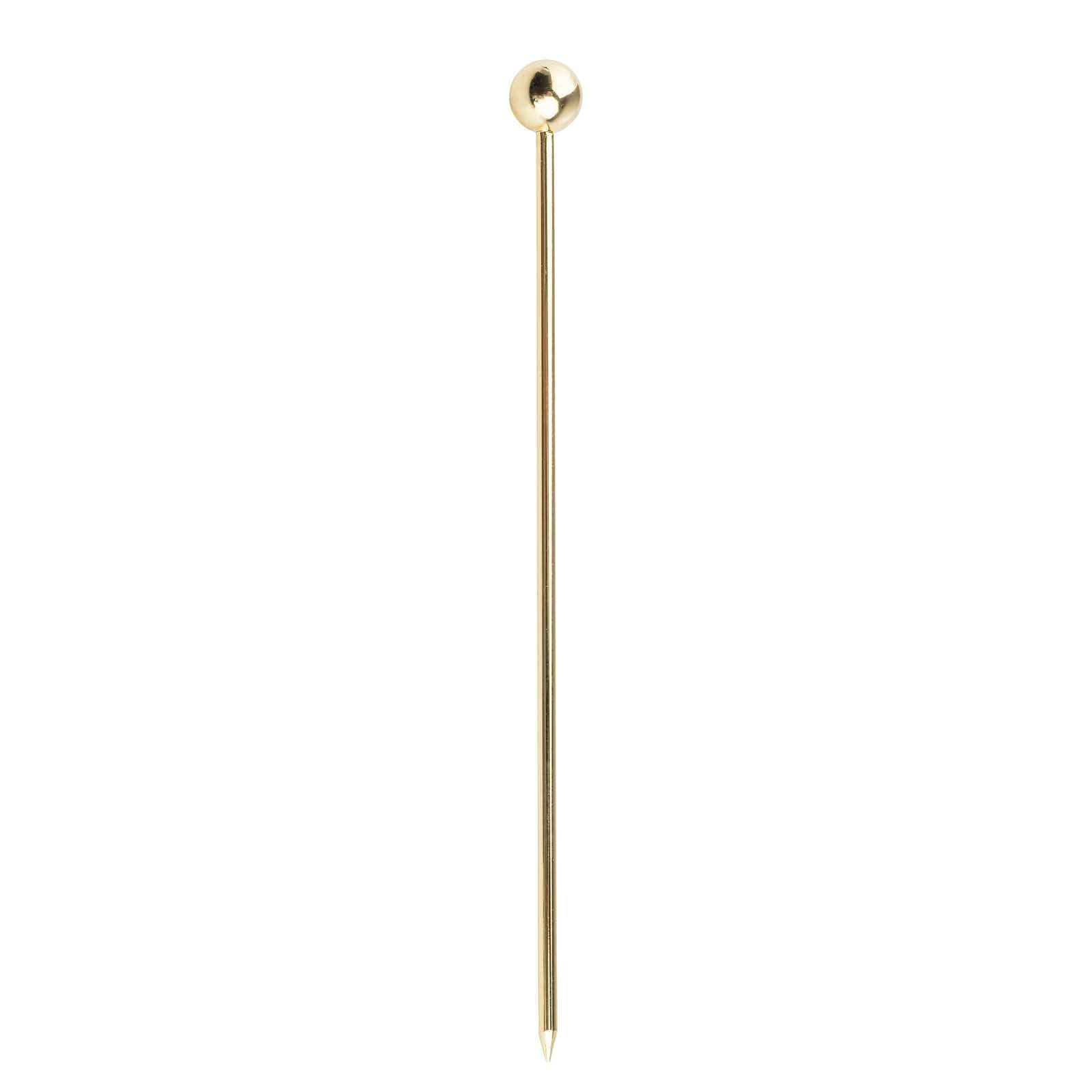 Gold cocktail pick with a round head on a white background.
