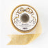 Gold sparkly ribbon on a white spool with scissors and a bow design.