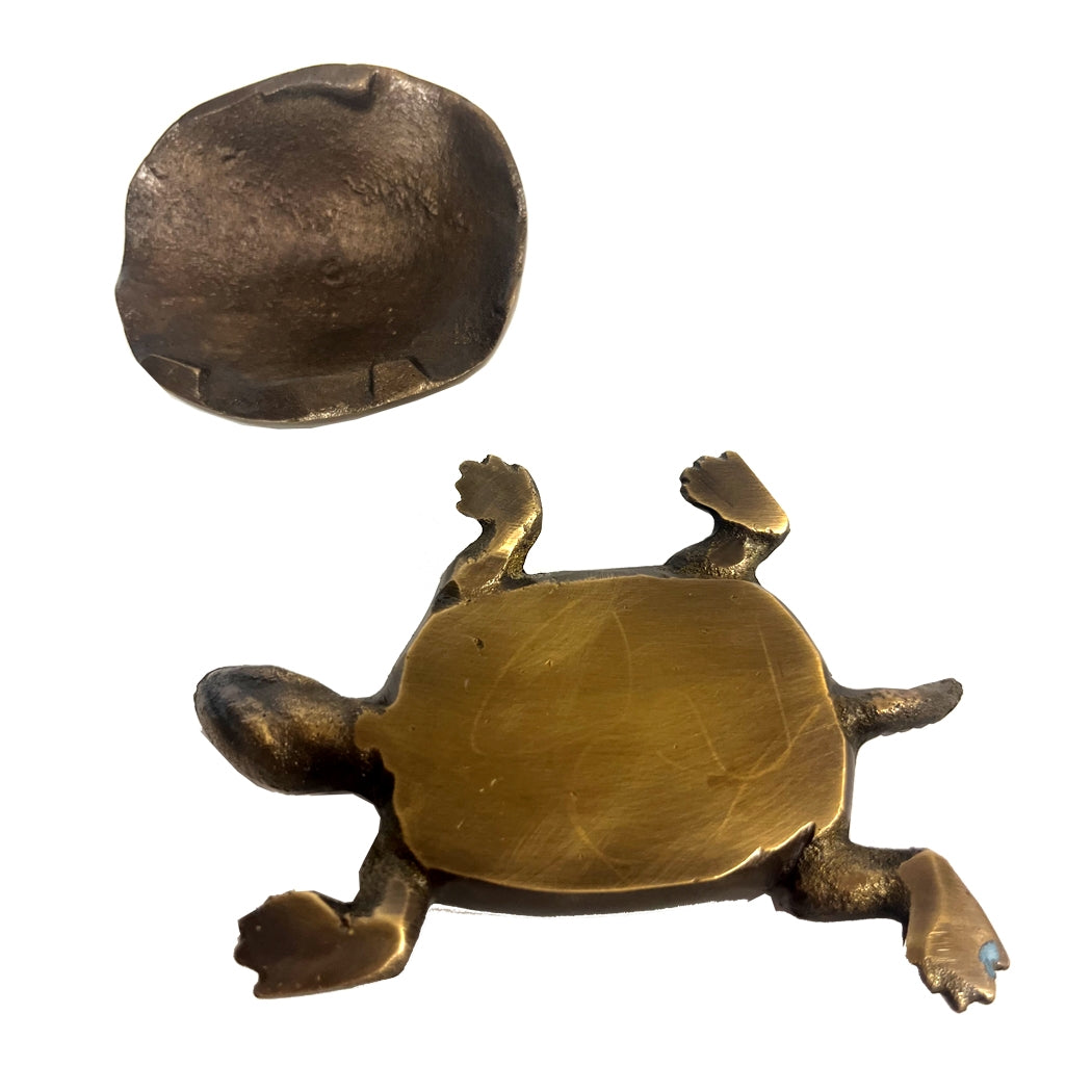 Brass turtle figurine with intricate design on a white background.