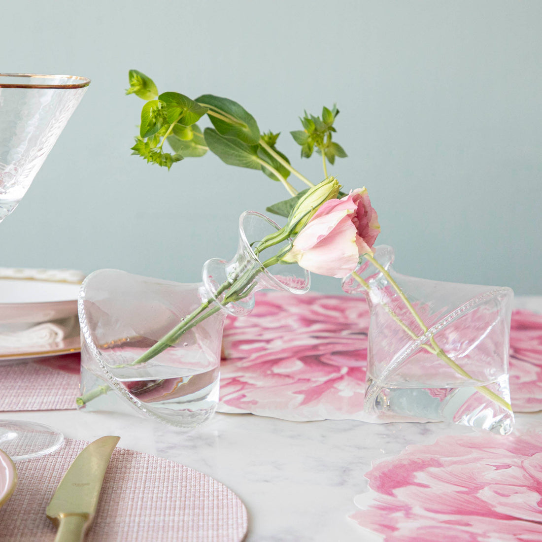 A Qualia mouth blown clear vase - exclusively at Hester &amp; Cook, displaying a small bouquet of favorite flowers.