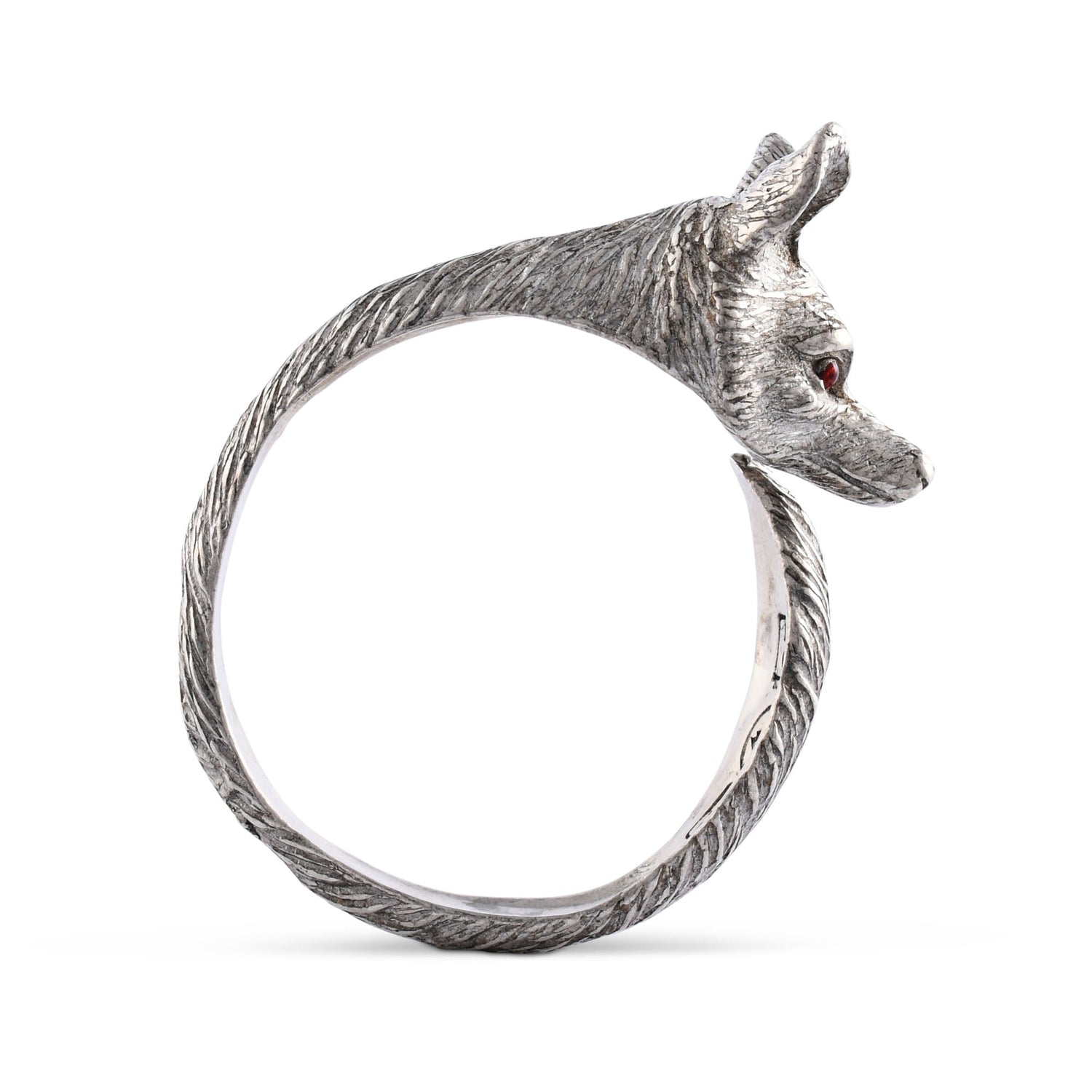 Silver napkin ring with a fox design and red eyes on a white background.
