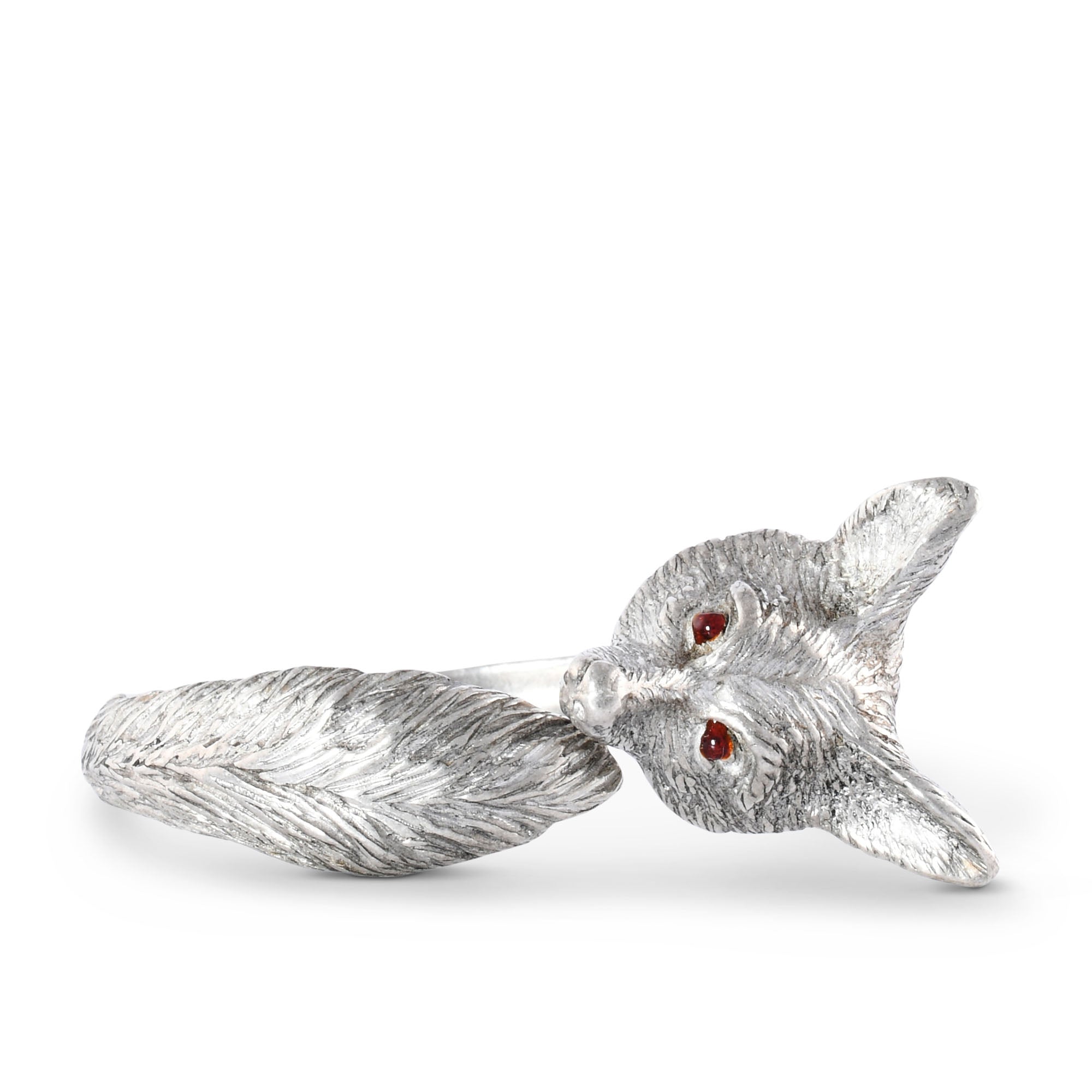 Silver fox napkin ring with red eyes on a white background.