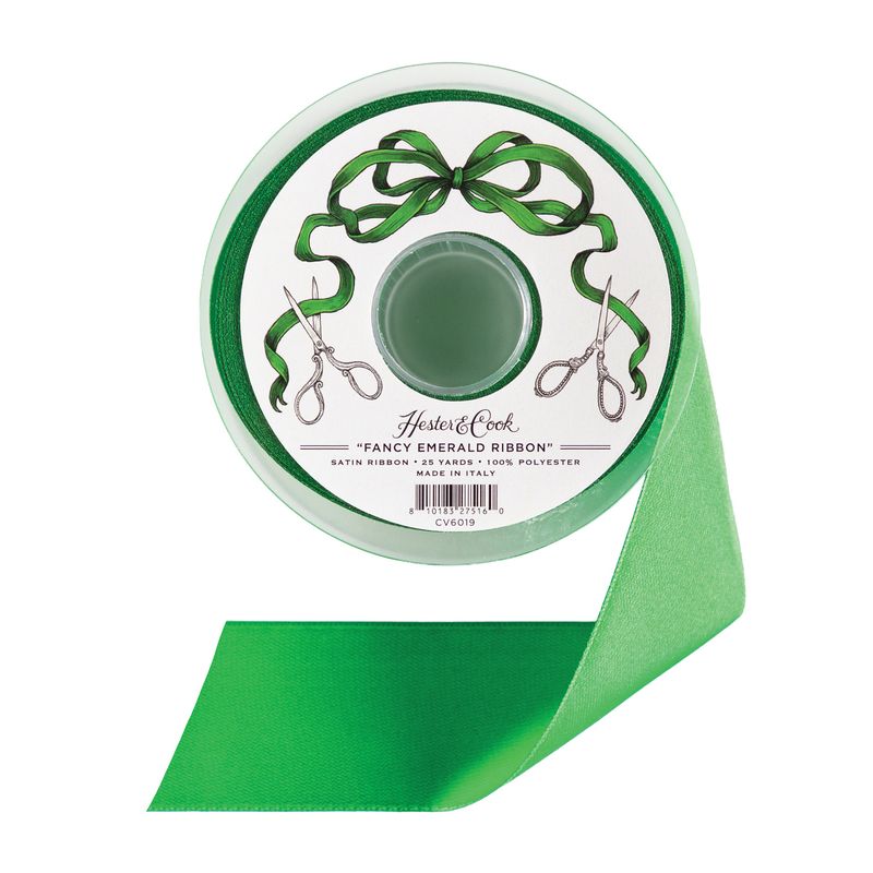 A spool of emerald green satin ribbon by Hester &amp; Cook, on a white background. 