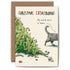 A toppled Christmas tree with scattered broken ornaments and a cat walking away. The card reads “Christmas CATastrophe” and “My work here is done.” indicating the cat&