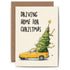 An illustration of a singing bird with a beanie on, driving a yellow car with a Christmas tree coming sticking out of the trunk and the words "Driving home for Christmas".