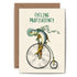 An illustrated blank Cycling Profishiency Card from Hester & Cook stationery, a UK based company, featuring a whimsical depiction of a fish riding an old-fashioned penny-farthing bicycle with the caption "C