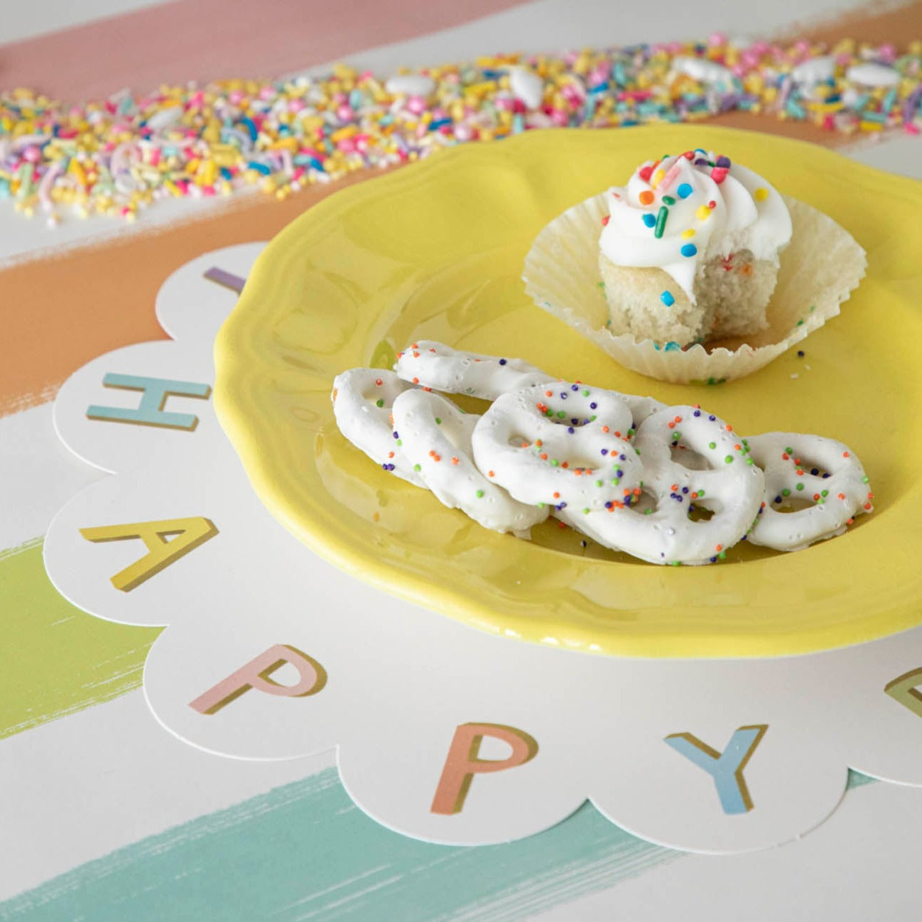A Happy Birthday Serving Papers from Hester &amp; Cook, with a cupcake and pretzels on it, perfect for charcuterie spreads.