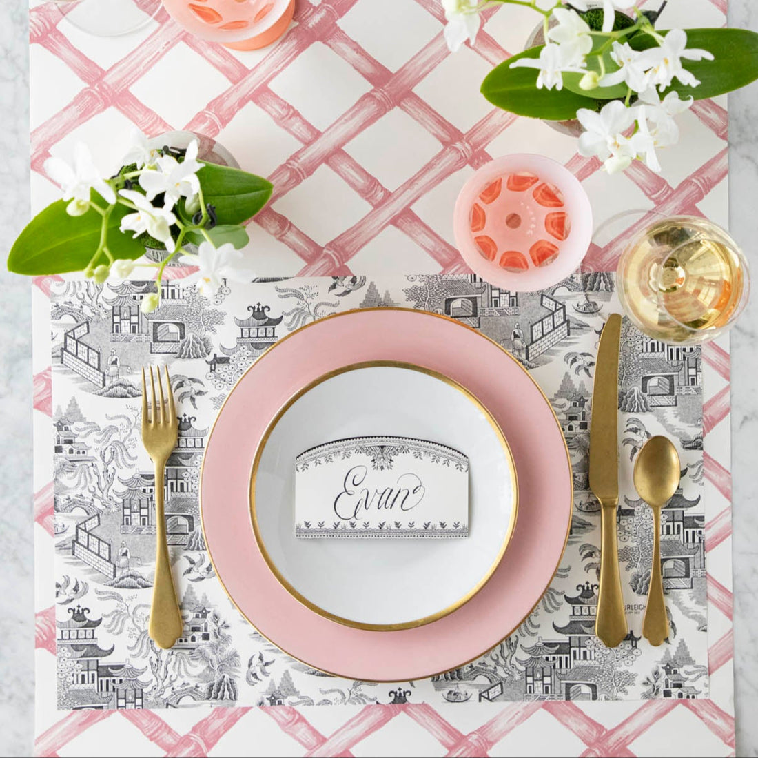 Black Willow Placemat on the Pink Lattice Runner, with an elegant place setting on top.