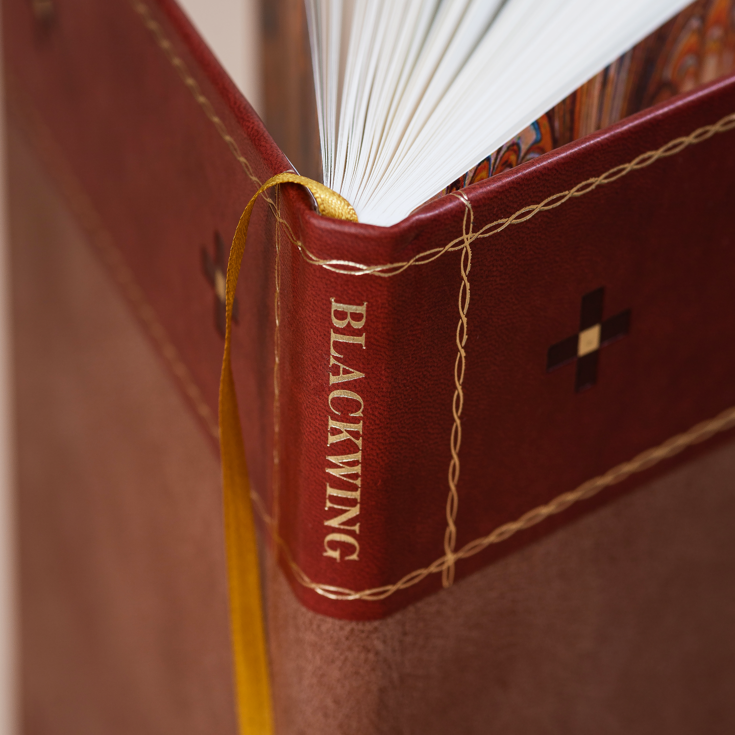 Close up of Blackwing stamp on the spine of the Blackwing Volume 574 notebook.