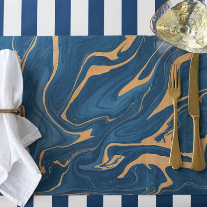 The Blue &amp; Gold Vein Marbled Placemat under an elegant  place setting.  