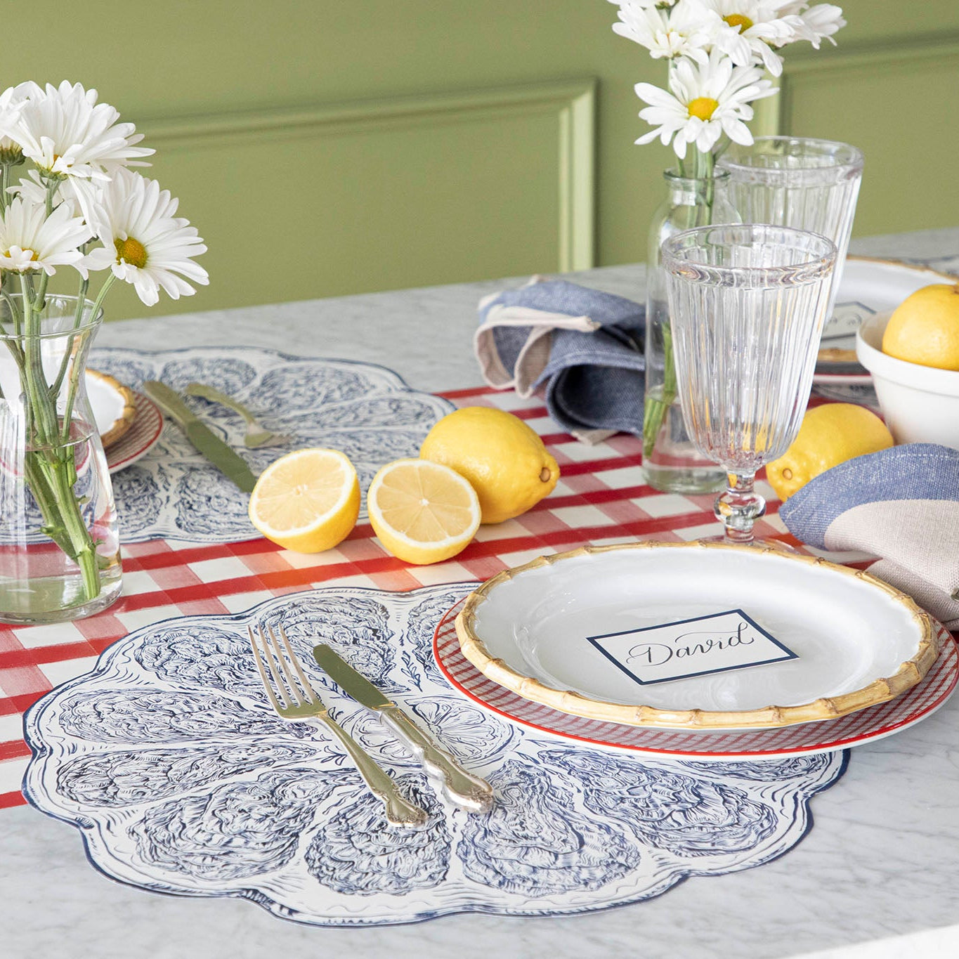 A summer themed table setting featuring the Die-cut Blue Oyster Plate Placemat.