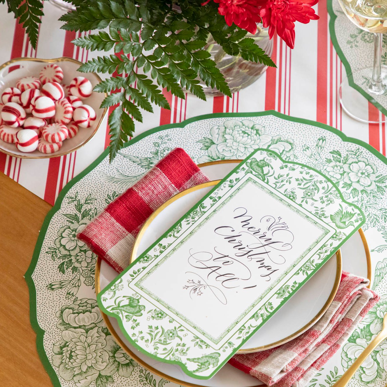 The Peppermint Stripe Runner in an elegant table setting with the Burleigh Green Placemat, florals and peppermints.