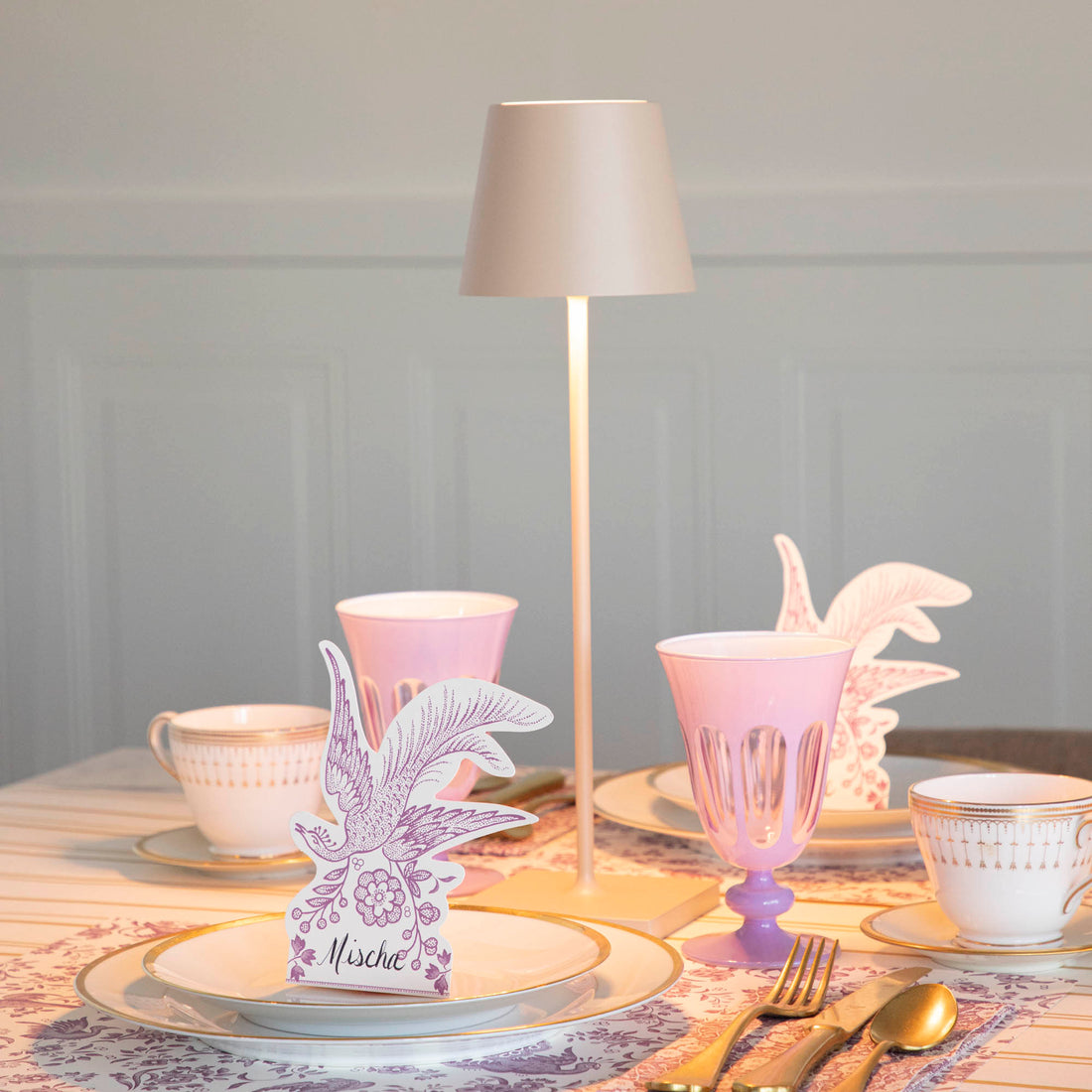 A Sand Cordless Lamp by Zafferano on a table.