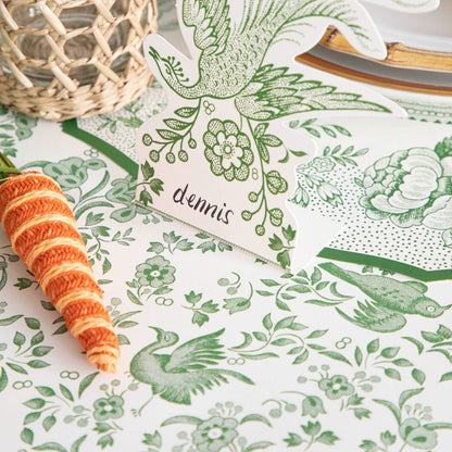 Close-up of the Green Regal Peacock Runner under an elegant place setting, showing the bird and floral design in detail.
